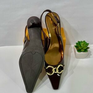 Etienne Aigner Brown Patent leather Slingback Heels w/ golden loops accents.